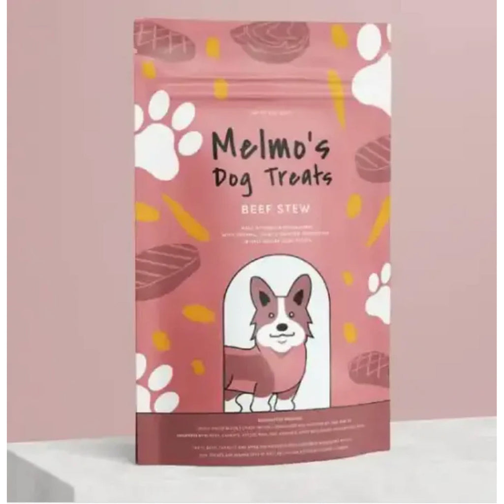 Dog treat package with pink background and cartoon dog, brand 'Melmo's Dog Treats' visible.