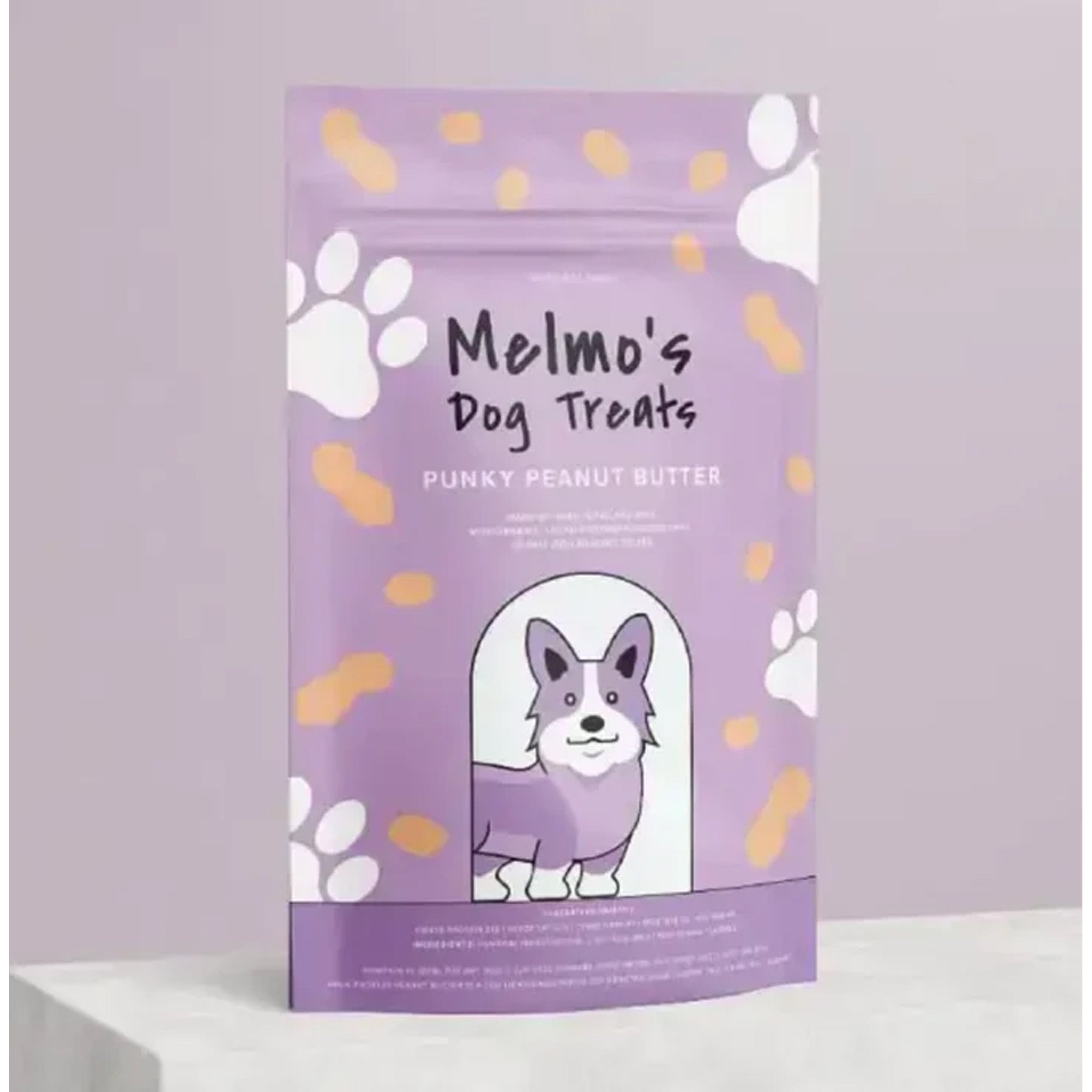 Purple package of Melmo's Dog Treats with a cartoon dog and paw prints on a light gray background