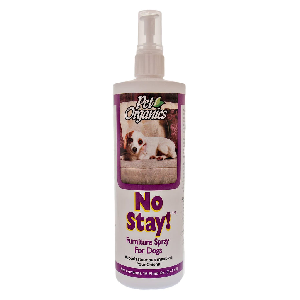 A bottle of Pet Organics No Stay! Furniture Spray for Dogs, featuring a white bottle with a purple label and a clear spray top, shown against a plain white background.