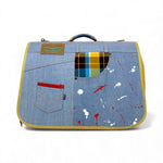 Load image into Gallery viewer, Denim-style bag with paint splatter design and plaid lining on a white background
