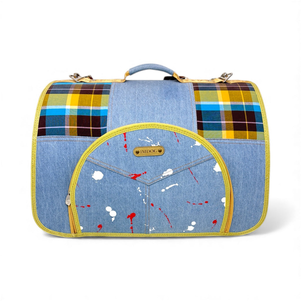 Multicolored plaid and denim pet carrier on a white background